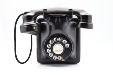 Old black phone with dial disk clipart