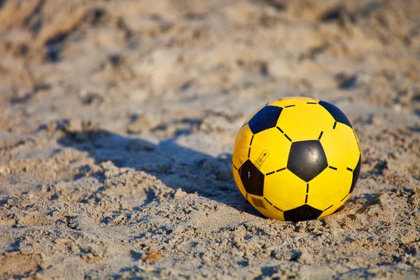 Ball in the beach sand — Stock Photo, Image