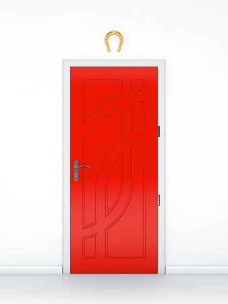 Дверь с золотой подковой — стоковое фото
