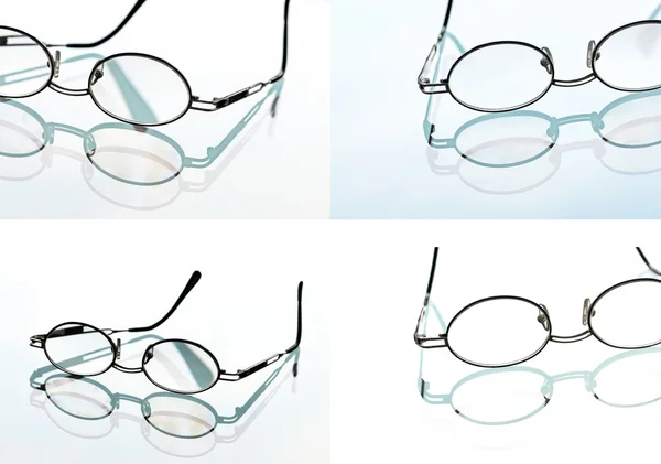 Vidros de leitura, óculos e seu reflexo contra fundo claro — Fotografia de Stock