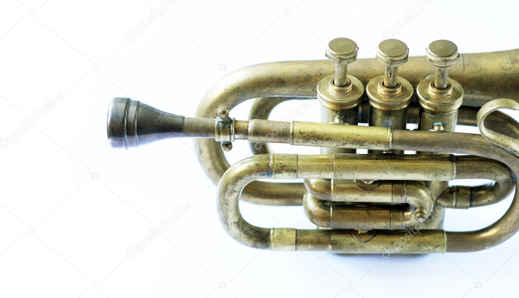 Beautiful old trumpet against white background
