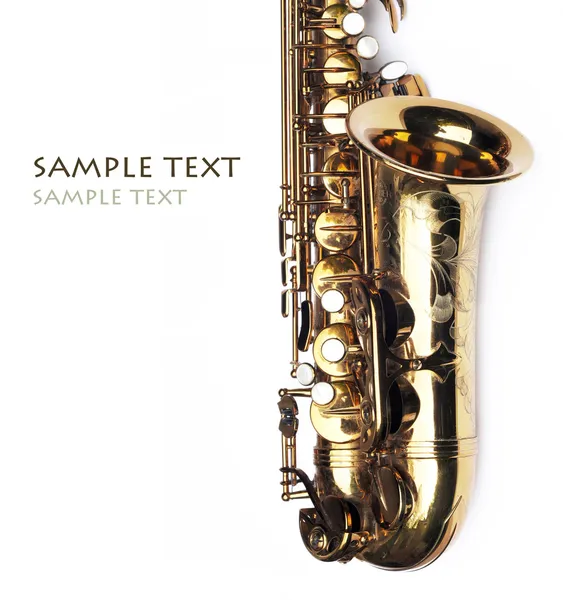 Close-up of a beautiful golden saxophone against white background Stock Image