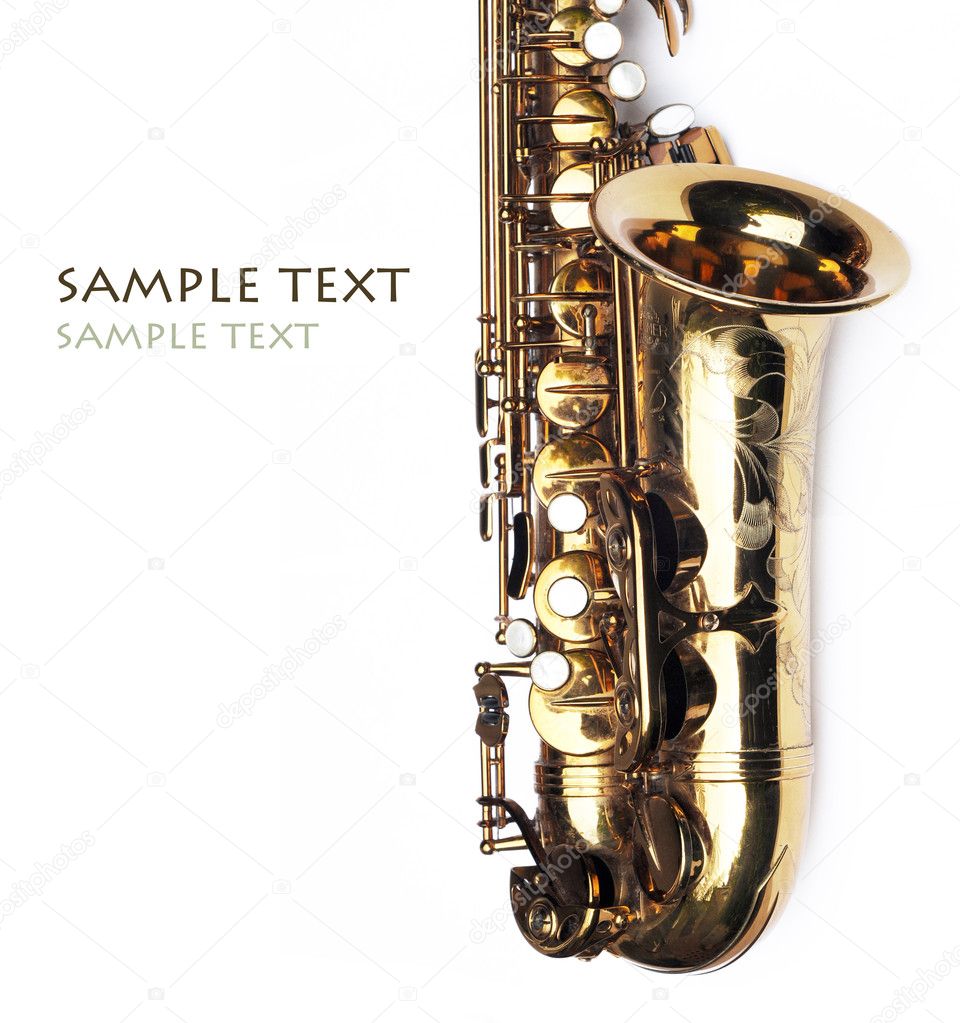 Close-up of a beautiful golden saxophone against white background