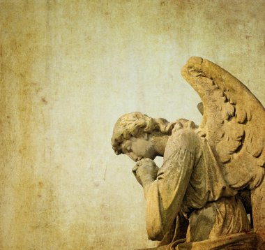 Statue of a stone cherubim angel in a cemetery in london, england clipart