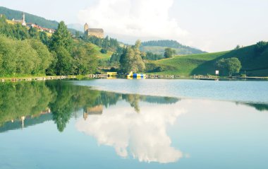 Lovely landscape with reflection in the swiss alps clipart