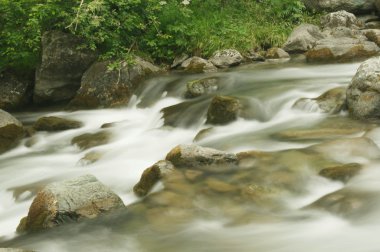 Flowing river (long exposure image) clipart