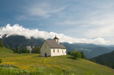 Church in alpine landscape clipart