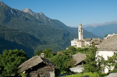 Picturesque old village (soglio) in alpine landscape (bregaglia region of switzerland) clipart