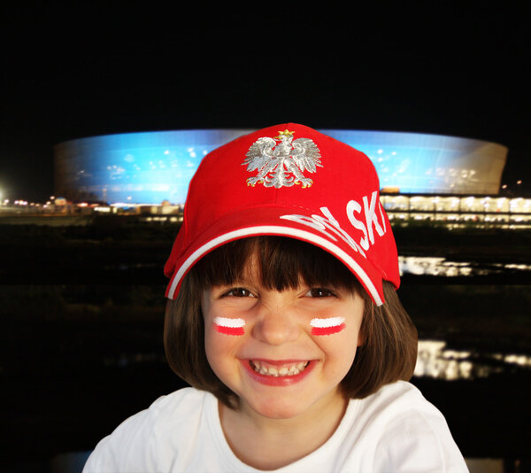 A fan on the background of the stadium at night. Wroclaw.