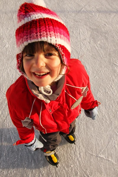 Smiling girl on ice skates — Stock Photo, Image