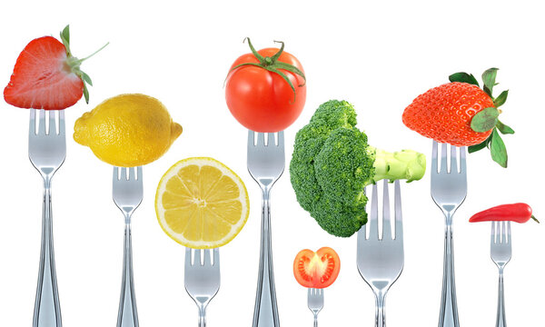 Fruit and vegetable on fork