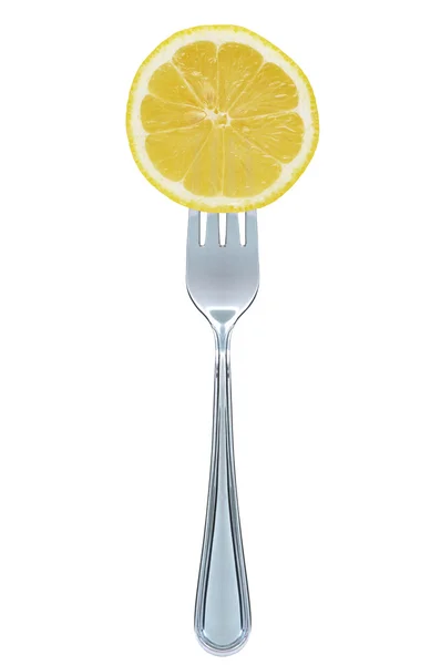 Лимон на вилке — стоковое фото