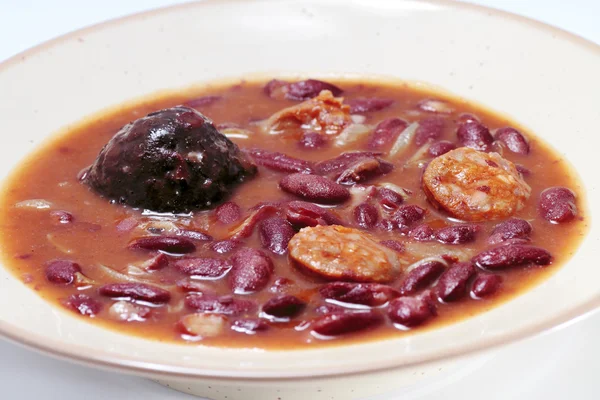 stock image Traditional dish in Spanish cuisine red beans with sausage and black pudding