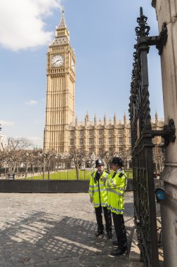 LONDON, UK - APRIL 02: Two policemen guard the front entrance to clipart