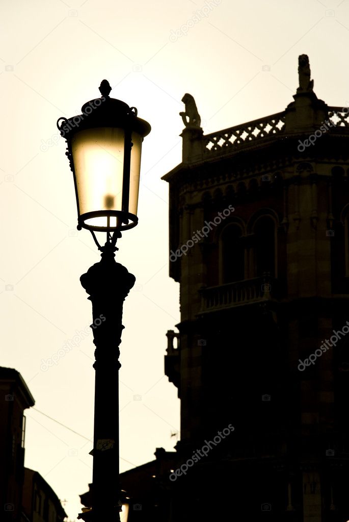 Late afternoon backlit lightpost in Padova