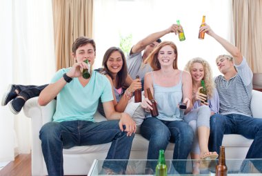 Friends drinking beer at home clipart