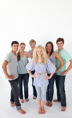 Group of friends standing against white background with copy-spa clipart