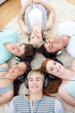 High angle of teenagers listening to music clipart