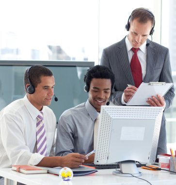 Manager and businessmen working in call center clipart