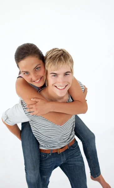Young boy giving his friend piggyback ride — Stock Photo, Image