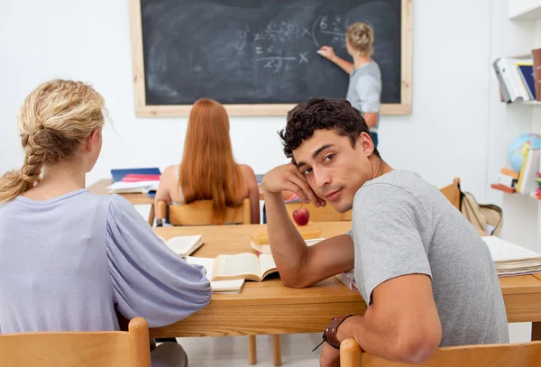 Teenagers studying together in a class — Stock Photo, Image