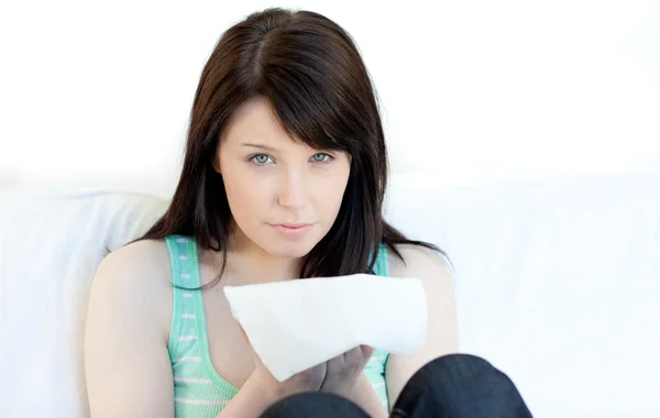 Portrait of a sick young woman blowing — Stock Photo, Image