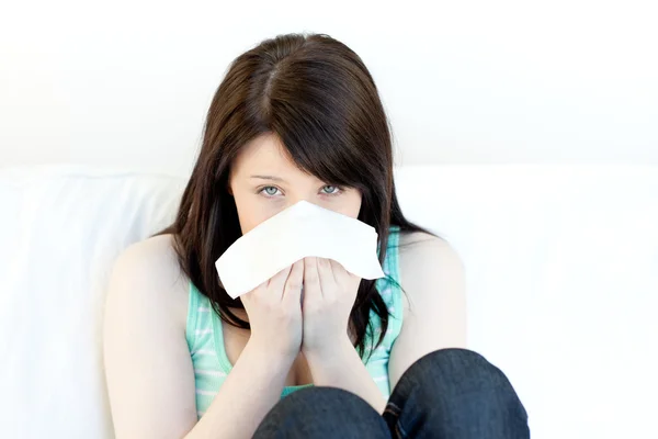 Portrait of a sick attractive woman blowing — Stock Photo, Image