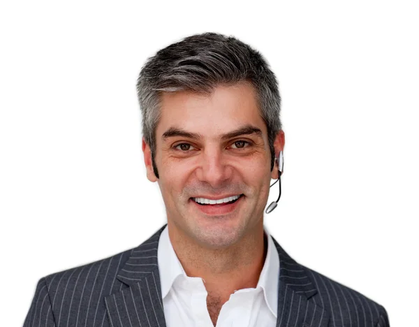 Sorridente uomo d'affari maturo con auricolare su — Foto Stock