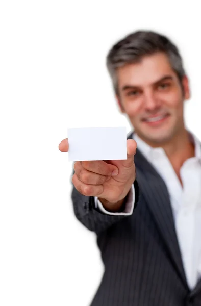 Confident businessman holding a white card — Stock Photo, Image