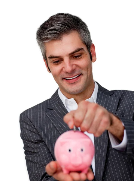 Успешный бизнесмен копит деньги в копилке — стоковое фото