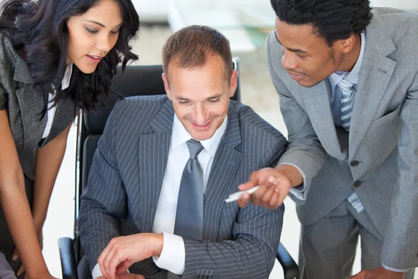 Manager with employees working in office — Stock Photo, Image