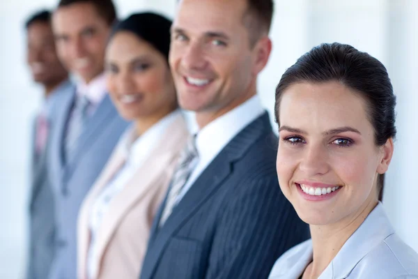 Attractive businesswoman with her team in a row — Stock Photo, Image