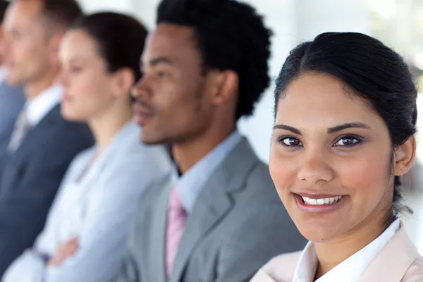 Beautiful businesswoman with her team in a line Stock Photo