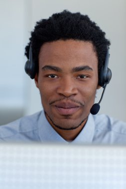 Portrait of Afro-American businessman in a call center clipart