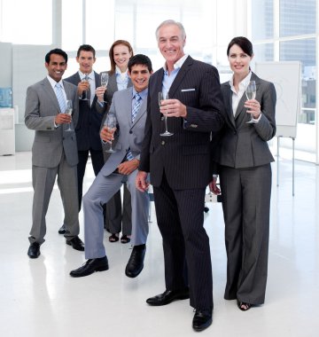 Multi-ethnic business toasting with Champagne clipart