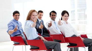Business with thumbs up at a conference clipart