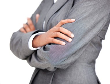 Close-up of a businesswoman with folded arms standing clipart