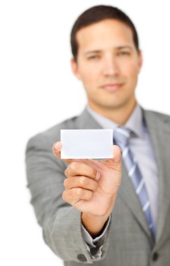 Composed young businessman holding a white card clipart