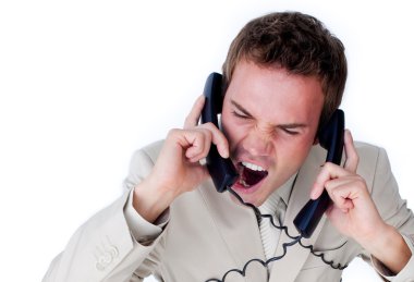 Frustrated businessman tangle up in phone wires clipart