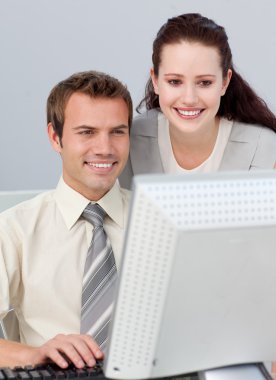 Young manager checking her employee's work in the office clipart