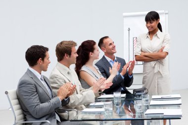 Business applauding a colleague after reporting to sales clipart