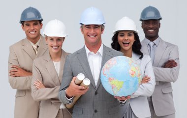 Enginner team holding a terrestrial globe clipart