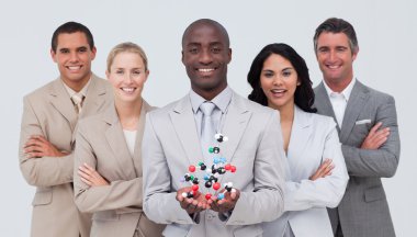 Business team holding a molecule model. Scince and business conc clipart
