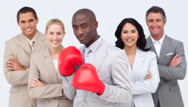 Afro-American businessman with boxing gloves leading his team clipart