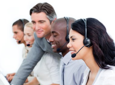 Charismatic manager and his team working in a call center clipart