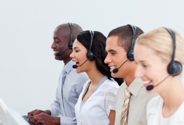 Enthusiastic business working in a call center clipart