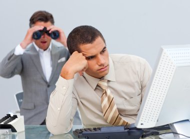 Young businessman getting bored and his manager looking through clipart