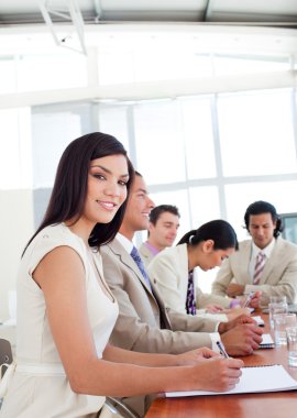 Portrait of a businesswoman and her team during a presentation clipart