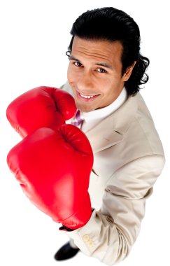 Competitive businessman wearing boxing gloves clipart