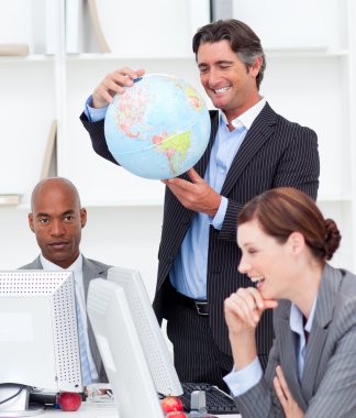 Portrait of a lucky business team talking about globalization clipart